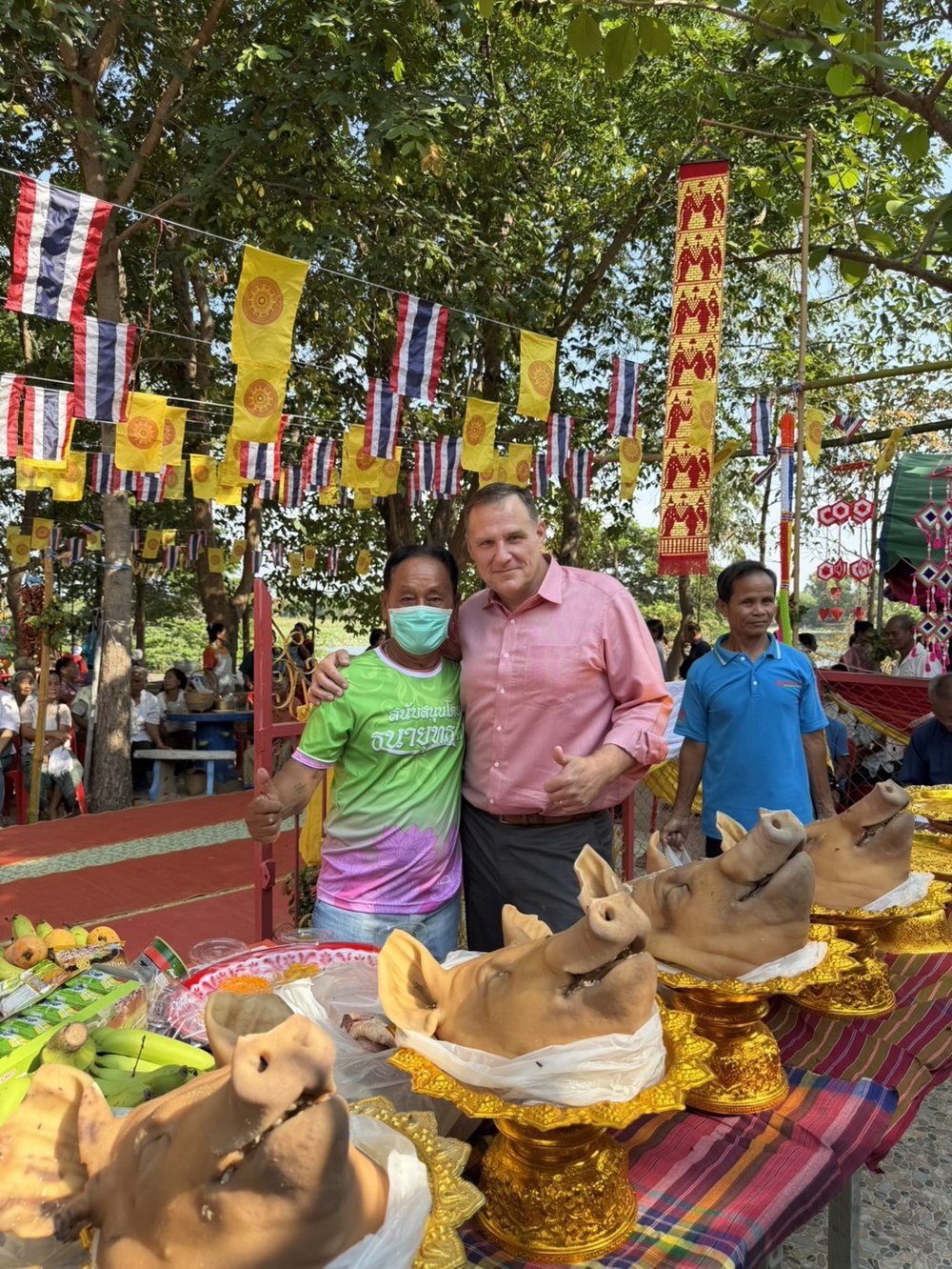 Benjamin Cunningham at a Thai temple merit-making festival with community members