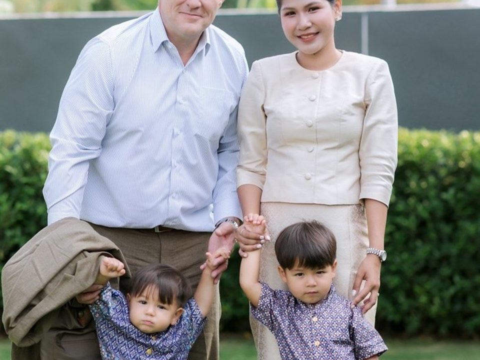 Benjamin Cunningham with his wife Ploy and their two sons in Thai dress